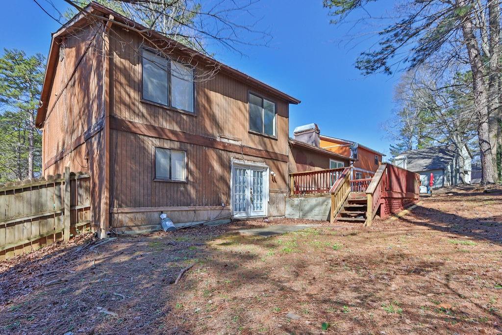 5409 Biffle Downs Road Stone Mountain, GA 30088 - Photo 26 of 27 a view of a house with a yard