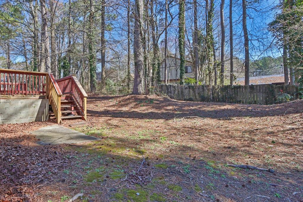 5409 Biffle Downs Road Stone Mountain, GA 30088 - Photo 27 of 27 a view of outdoor space with trees