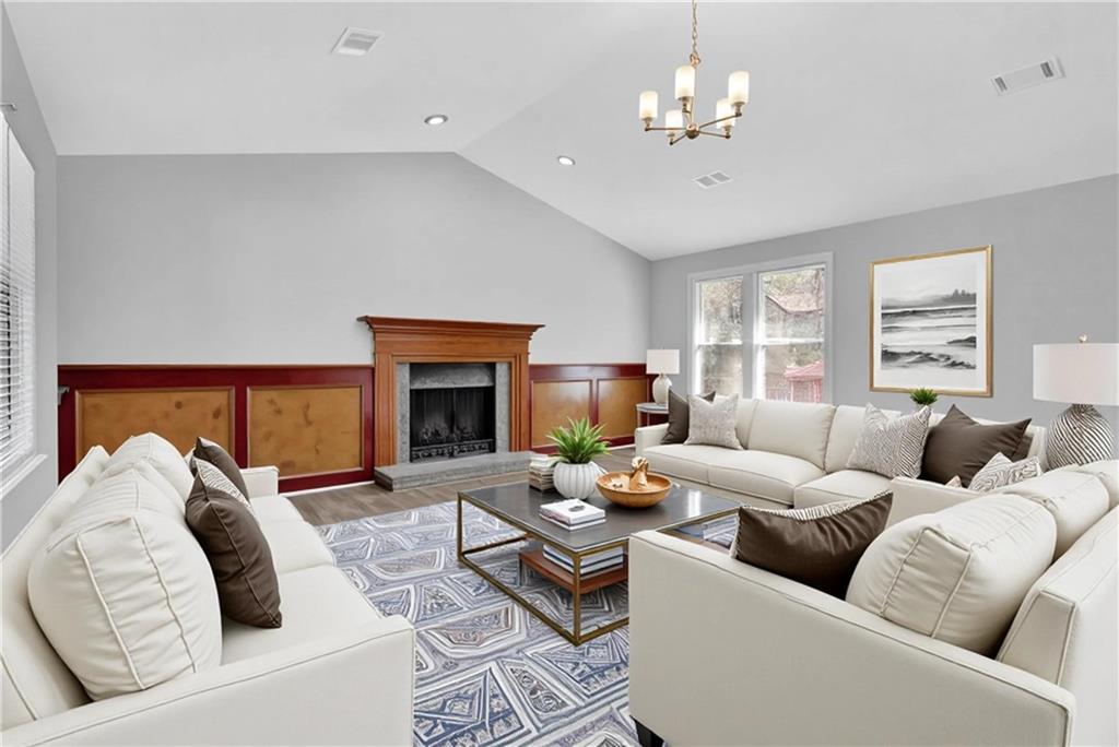 5409 Biffle Downs Road Stone Mountain, GA 30088 - Photo 4 of 27 a living room with furniture and a fireplace