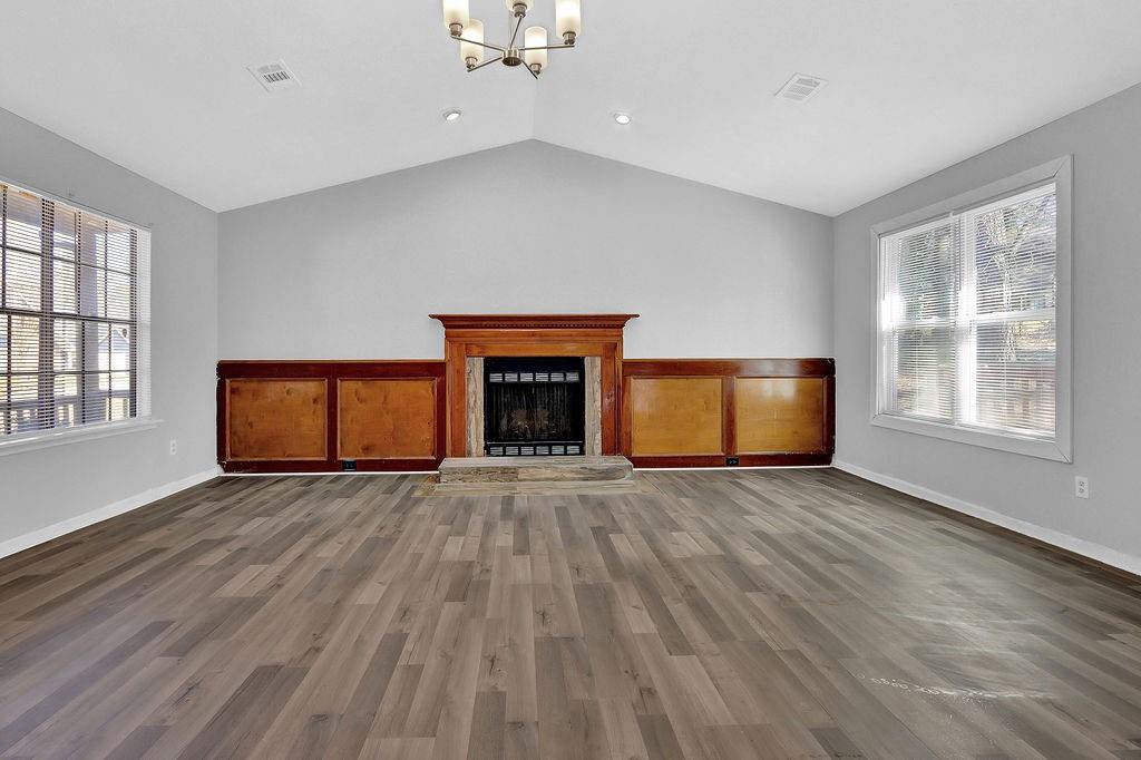 5409 Biffle Downs Road Stone Mountain, GA 30088 - Photo 5 of 27 a view of an empty room with a window and fireplace