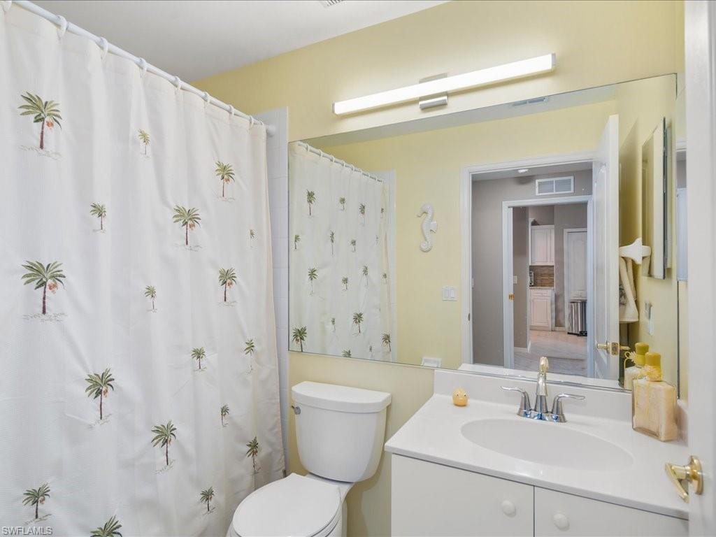 2810 Cypress Trace Circle, Unit 2127 Naples, FL 34119 - Photo 21 of 28 a bathroom with a sink toilet and shower