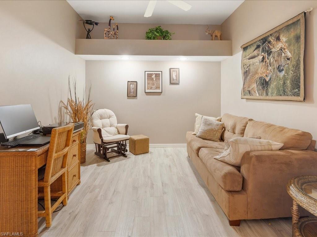 2810 Cypress Trace Circle, Unit 2127 Naples, FL 34119 - Photo 22 of 28 a living room with furniture and a couch