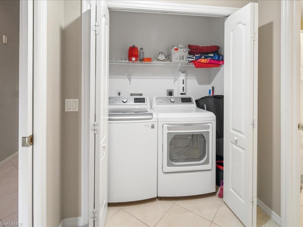 2810 Cypress Trace Circle, Unit 2127 Naples, FL 34119 - Photo 23 of 28 a utility room with sink dryer and washer