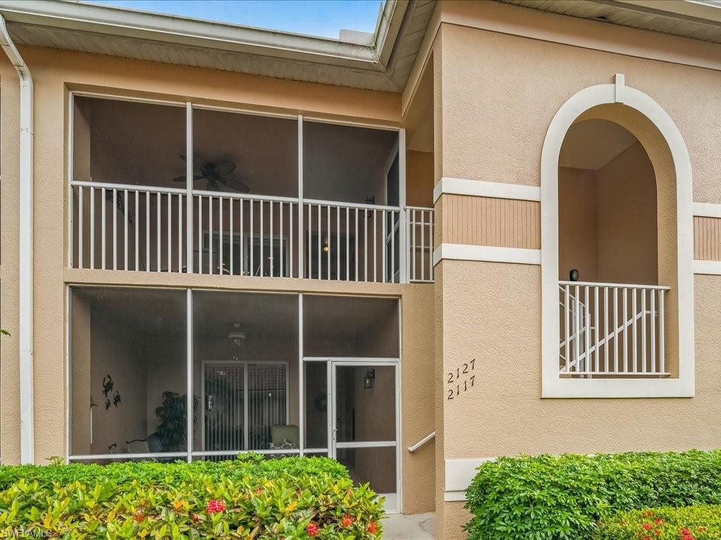 2810 Cypress Trace Circle, Unit 2127 Naples, FL 34119 - Photo 4 of 28 a view of front door of house