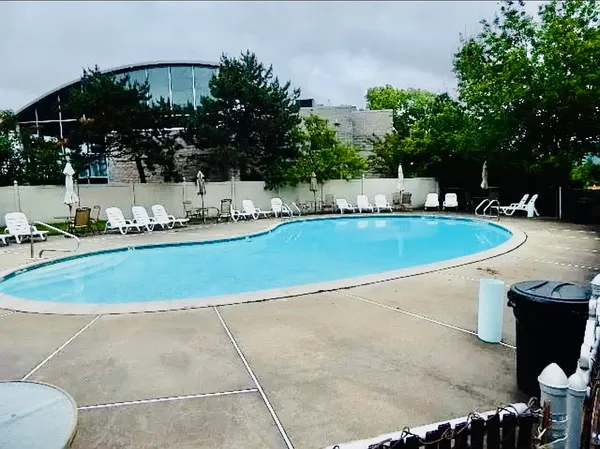 a view of a swimming pool with a patio