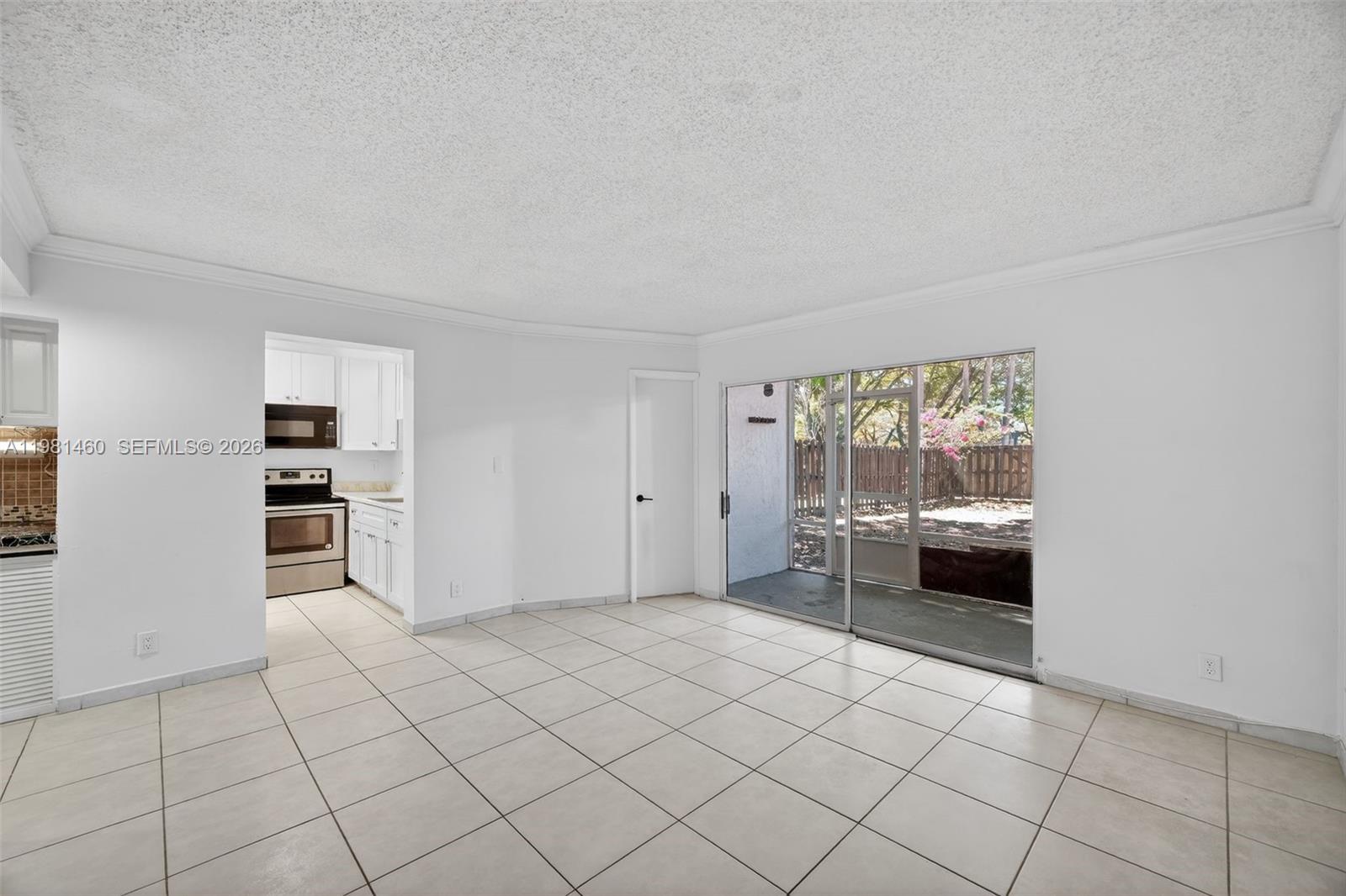 9436 Southwest 140th Court, Unit 9436 Miami, FL 33186 - Photo 16 of 40 a view of an empty room with a window
