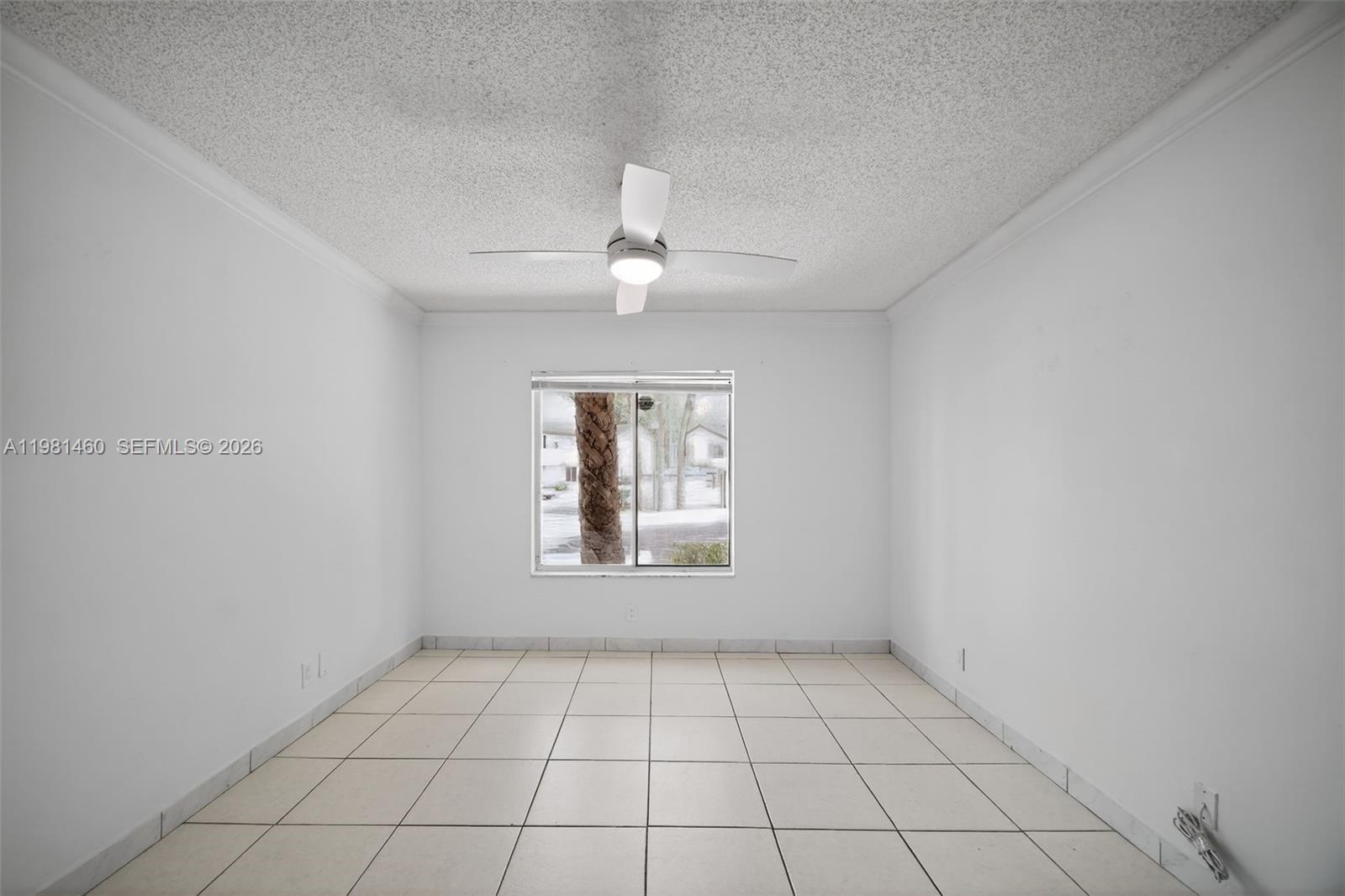 9436 Southwest 140th Court, Unit 9436 Miami, FL 33186 - Photo 21 of 40 a view of an empty room with a window