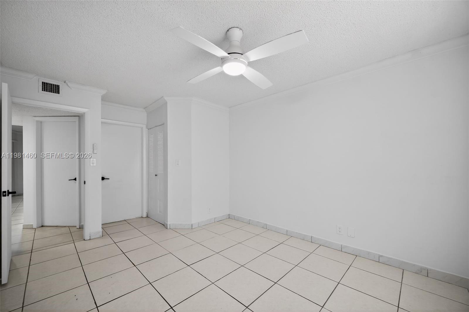 9436 Southwest 140th Court, Unit 9436 Miami, FL 33186 - Photo 22 of 40 a view of an empty room