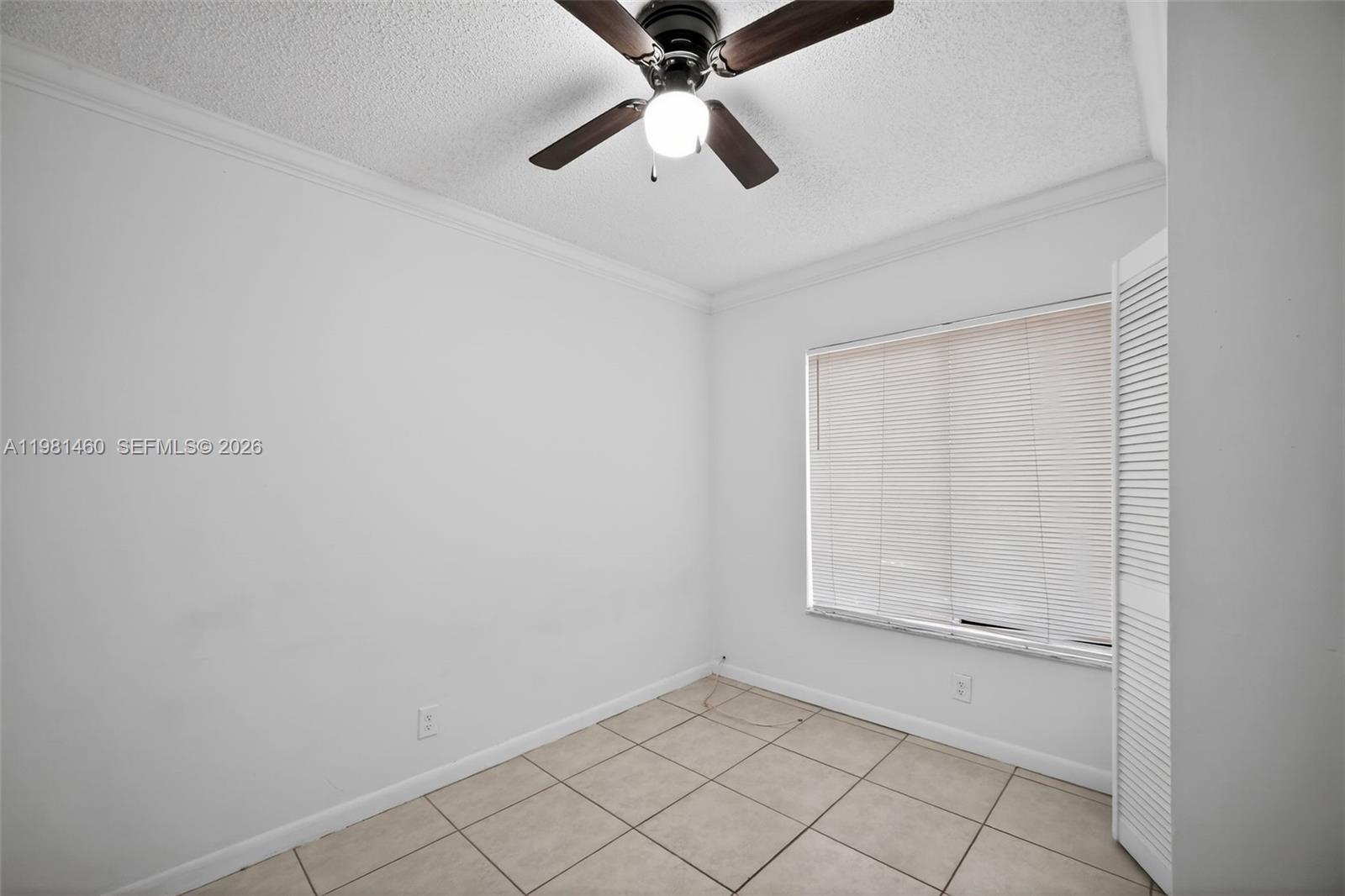 9436 Southwest 140th Court, Unit 9436 Miami, FL 33186 - Photo 27 of 40 a view of an empty room