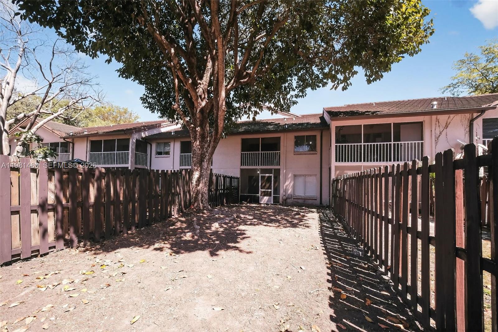 9436 Southwest 140th Court, Unit 9436 Miami, FL 33186 - Photo 32 of 40 a front view of house with yard outdoor seating and barbeque oven