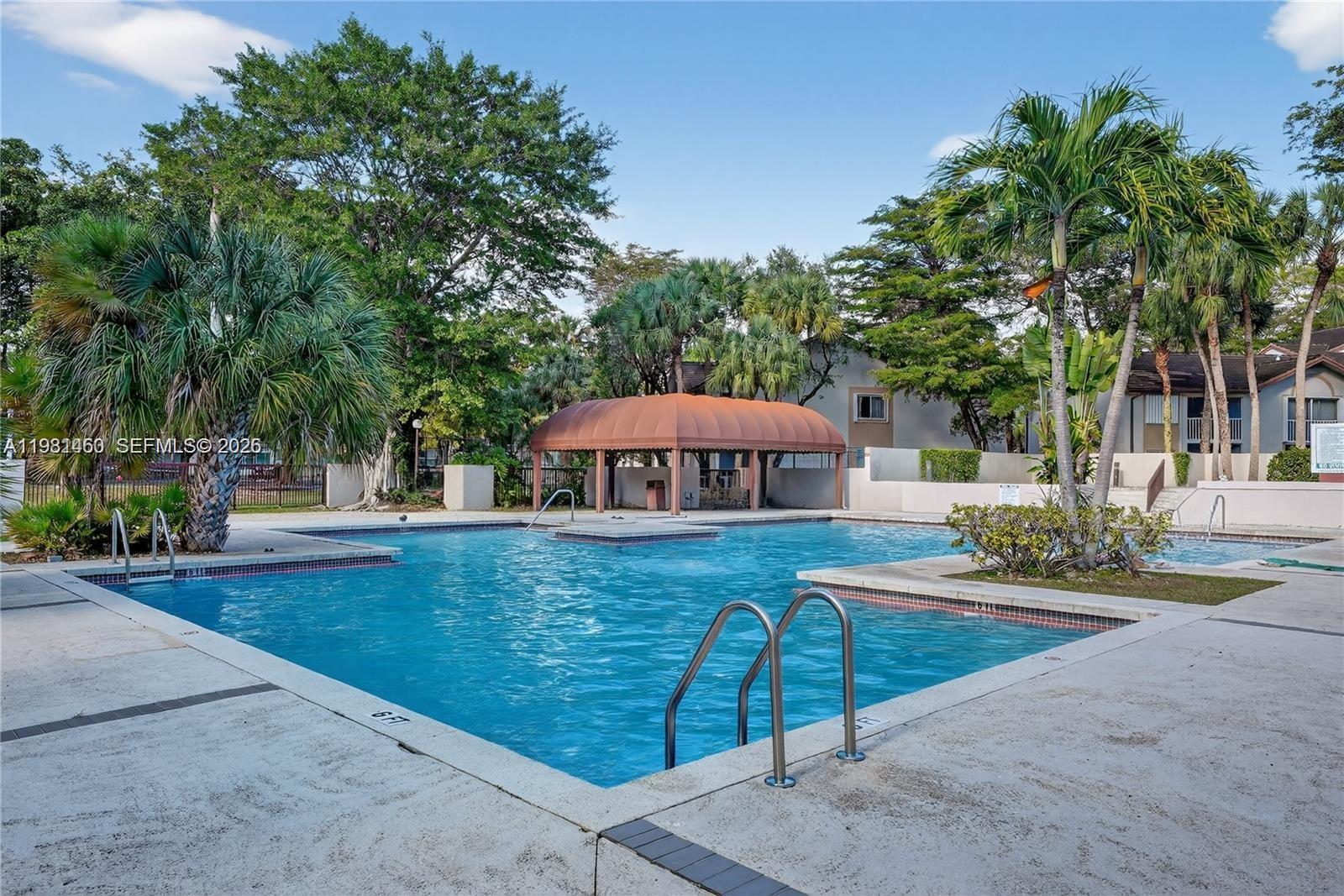 9436 Southwest 140th Court, Unit 9436 Miami, FL 33186 - Photo 35 of 40 a view of a house with backyard and sitting area