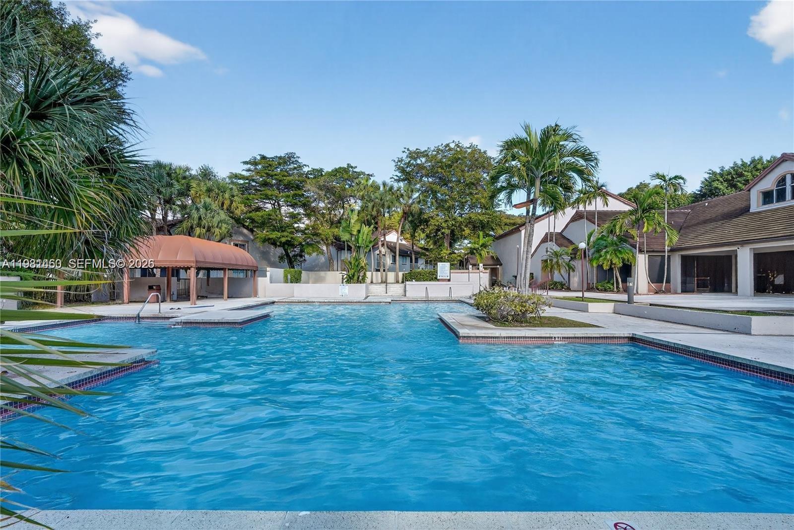 9436 Southwest 140th Court, Unit 9436 Miami, FL 33186 - Photo 36 of 40 a view of a house with pool and a yard