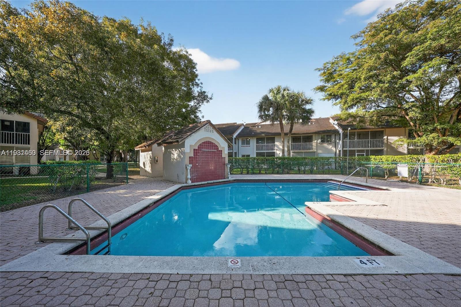 9436 Southwest 140th Court, Unit 9436 Miami, FL 33186 - Photo 37 of 40 a view of swimming pool with a patio