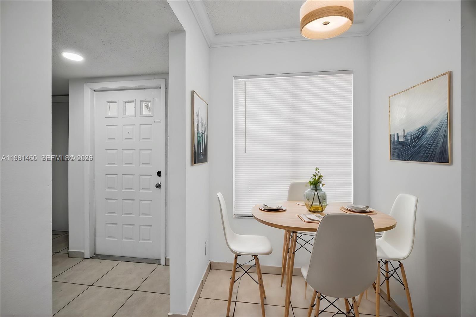 9436 Southwest 140th Court, Unit 9436 Miami, FL 33186 - Photo 9 of 40 a view of a dining room with furniture and wooden floor