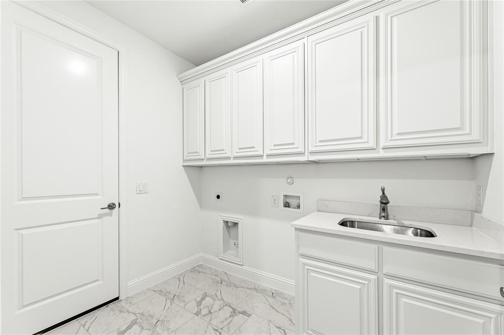 1145 Hitching Post Way Oak Point, TX 75068 - Photo 10 of 39 a kitchen with a sink and cabinets
