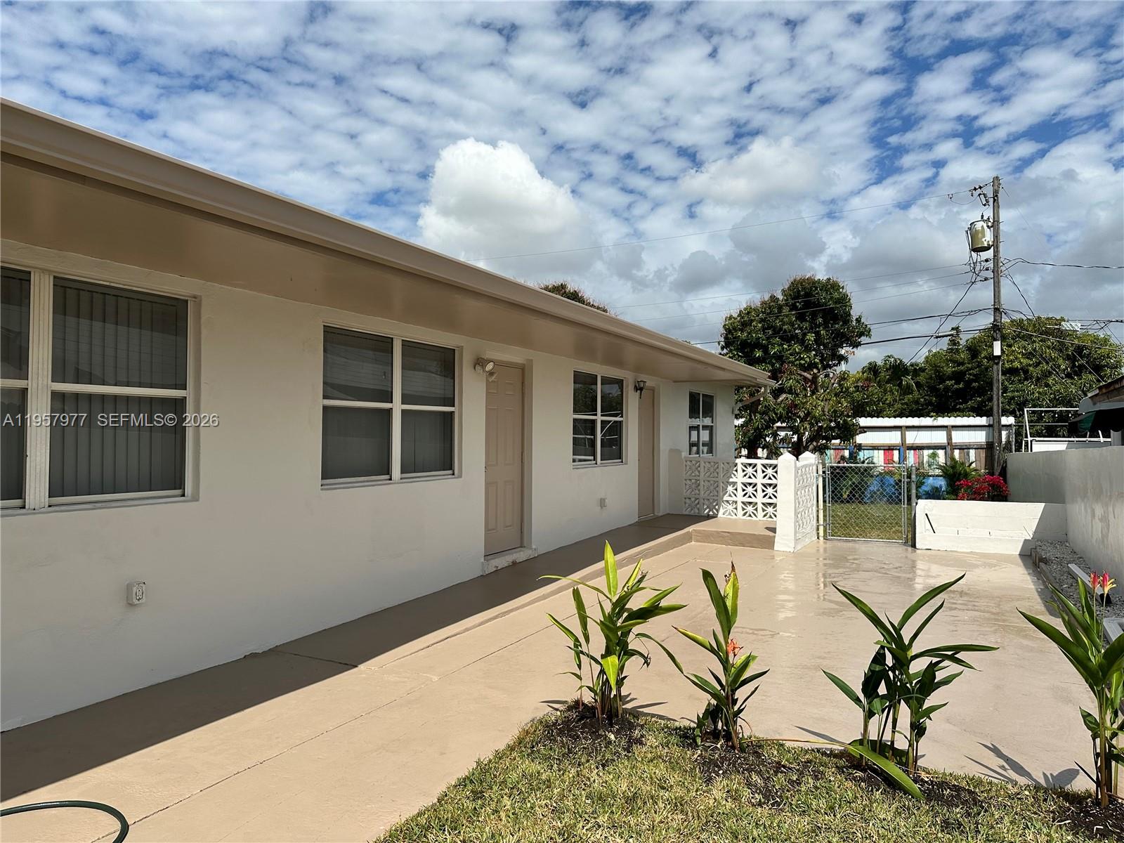 4727 Northwest 4th Street, Unit 4727 Miami, FL 33126 - Photo 11 of 14 a house view with a seating space