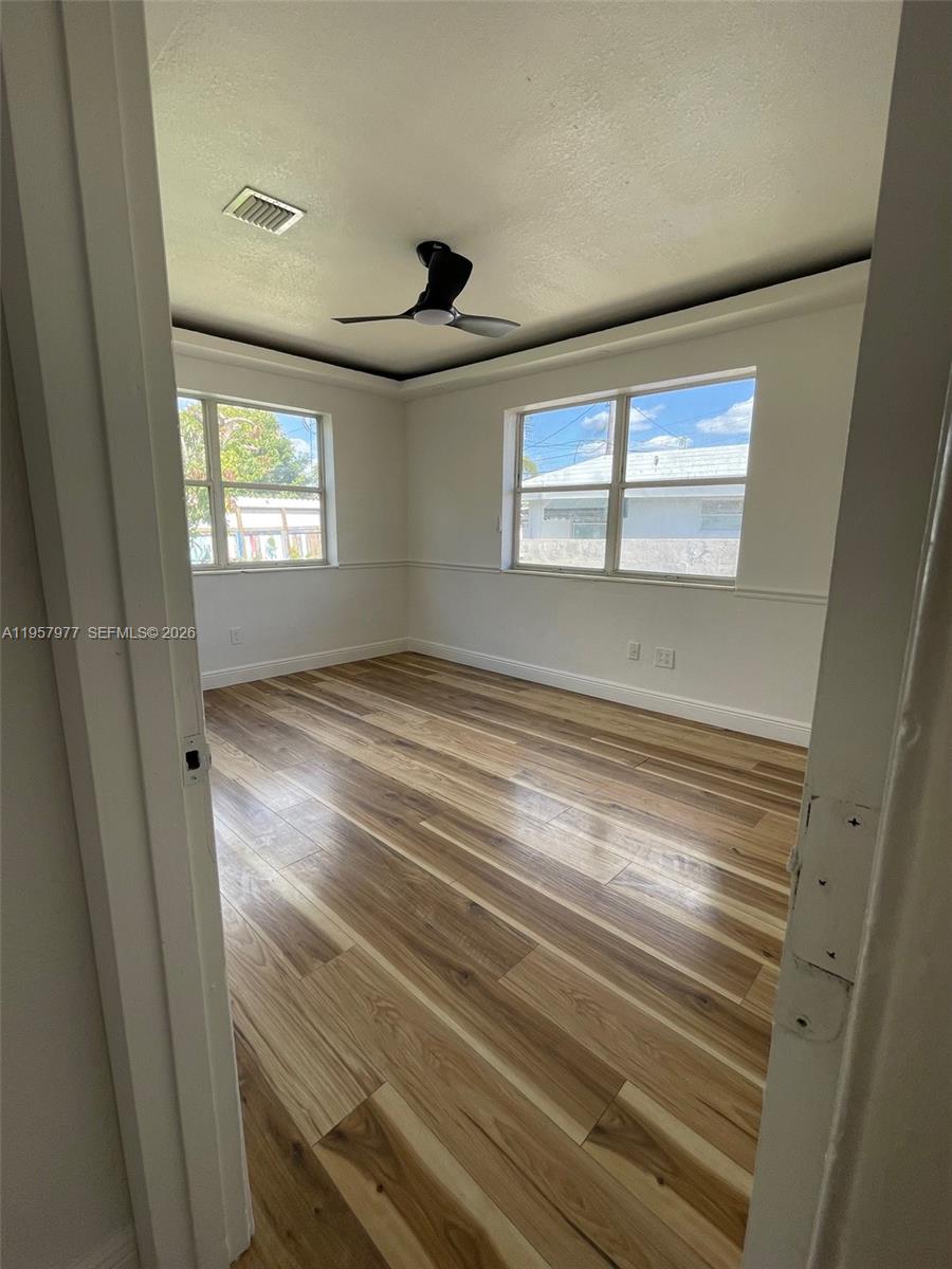 4727 Northwest 4th Street, Unit 4727 Miami, FL 33126 - Photo 8 of 14 a view of empty room with window and ceiling fan