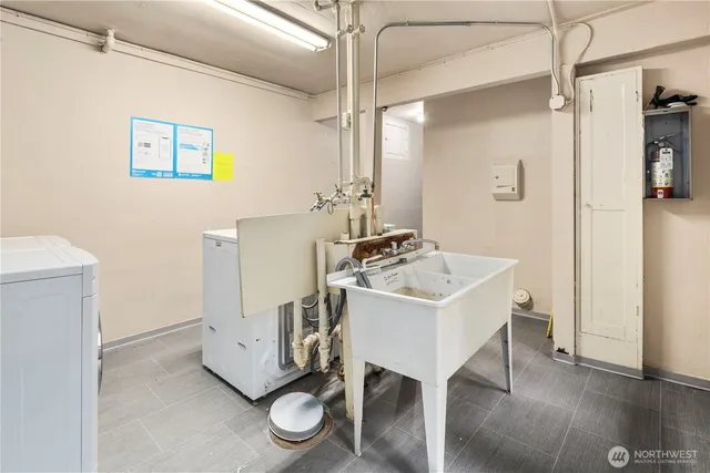 a view of a hallway with workspace and a bathroom