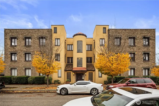 a car parked in front of a brick building