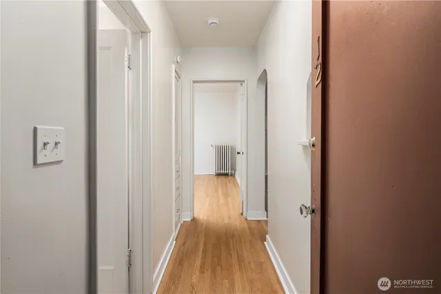 a view of a bathroom from a hallway