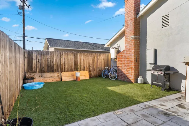 a view of a backyard with sitting area