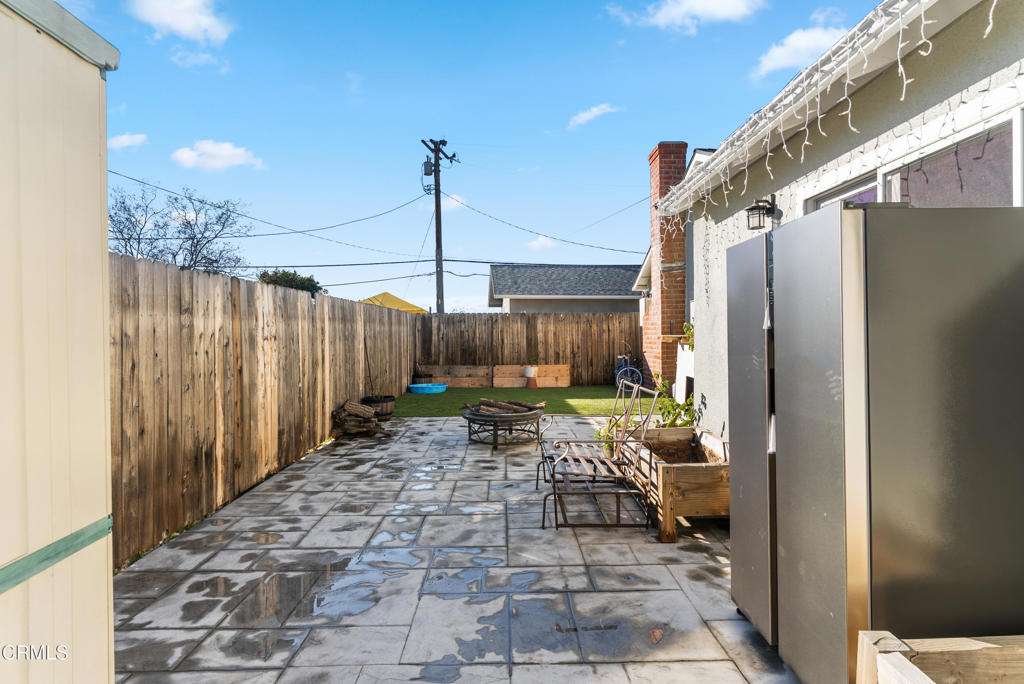 2549 Young Avenue, Unit B Thousand Oaks, CA 91360 - Photo 14 of 14 a view of a chairs and table in the patio with a glass door