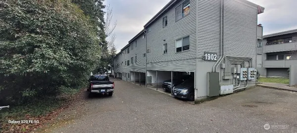 a view of a car park in front of house