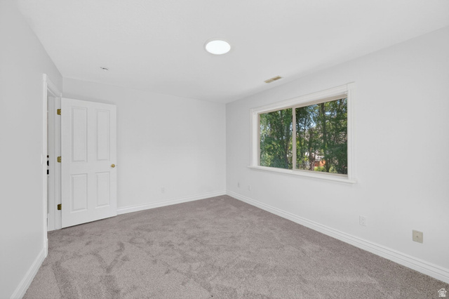 883 East 700 South Springville, UT 84663 - Photo 22 of 59 Neutral-toned carpeting complements the white walls and trim