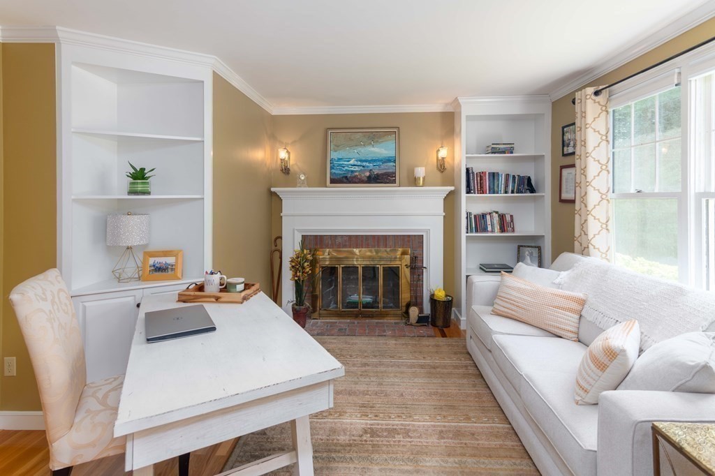 10 Windsor Lane Marshfield, MA 02050 - Photo 14 of 31 a living room with furniture and a fireplace