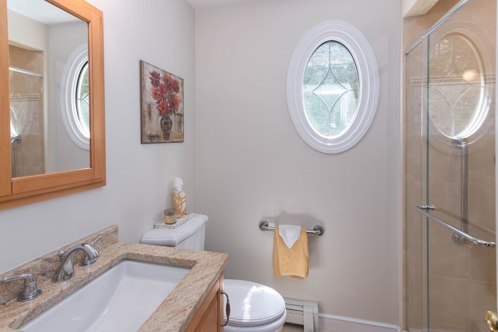 10 Windsor Lane Marshfield, MA 02050 - Photo 16 of 31 a bathroom with a toilet and a sink