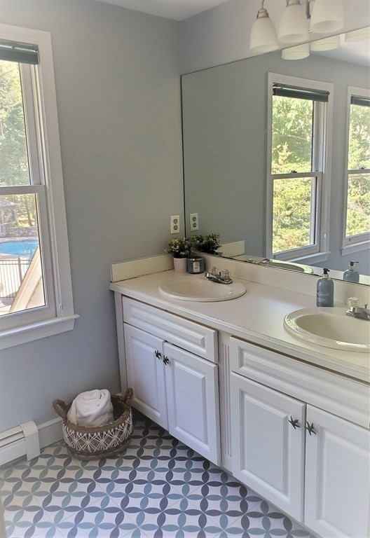 10 Windsor Lane Marshfield, MA 02050 - Photo 20 of 31 a bathroom with a sink toilet and window