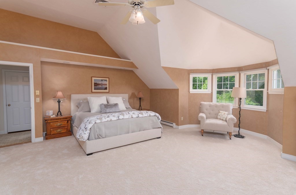 10 Windsor Lane Marshfield, MA 02050 - Photo 21 of 31 a spacious bedroom with a bed and a couch