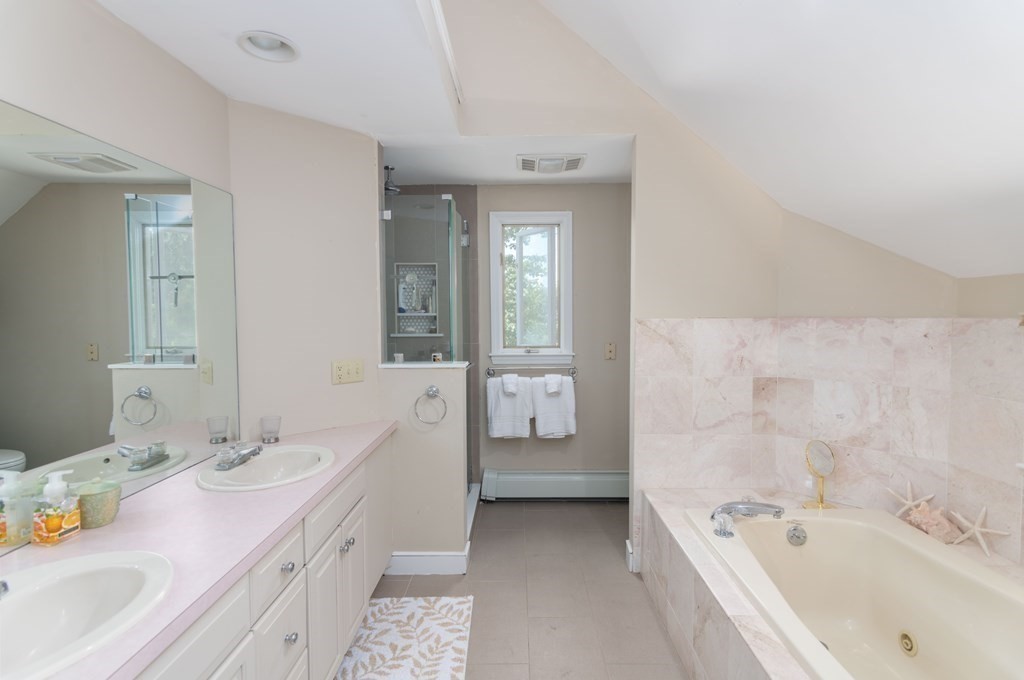10 Windsor Lane Marshfield, MA 02050 - Photo 23 of 31 a bathroom with a tub sink and mirror
