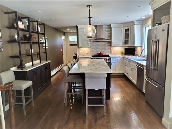 10 Windsor Lane Marshfield, MA 02050 - Photo 6 of 31 a large kitchen with a table and chairs