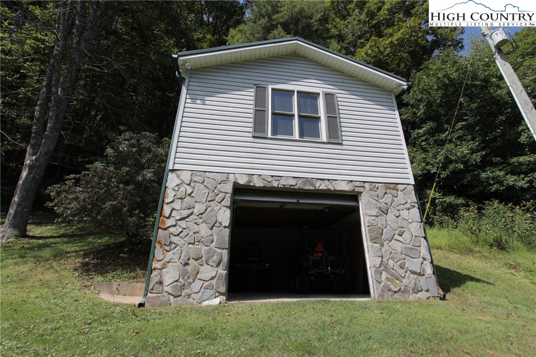 581 North Fork New River Road Lansing, NC 28643 - Photo 23 of 44 a view of a house with a yard