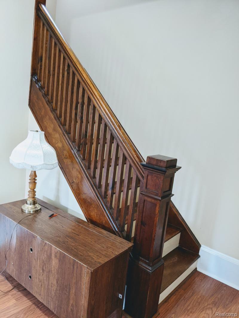 4245 Hellems Road Filion, MI 48432 - Photo 22 of 24 Original woodwork leading upstairs.jpg