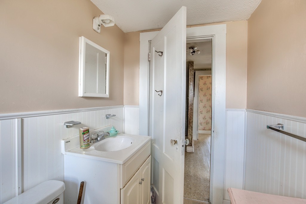 218 West Street Reading, MA 01867 - Photo 11 of 22 a bathroom with a sink vanity and a mirror
