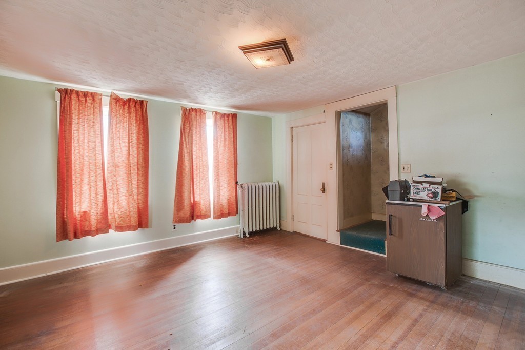 218 West Street Reading, MA 01867 - Photo 14 of 22 a view of a room with wooden floor and windows