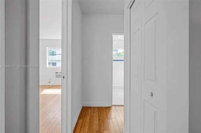 a view of a bathroom with a tub and shower