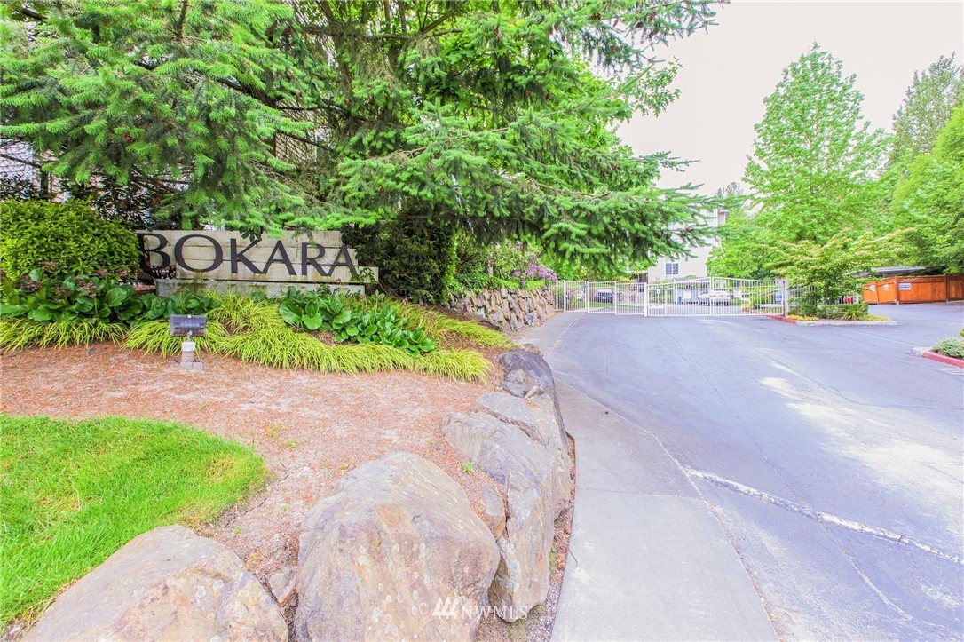 801 Rainier Avenue North, Unit G234 Renton, WA 98057 - Photo 2 of 19 a street sign that is sitting in the middle of a yard