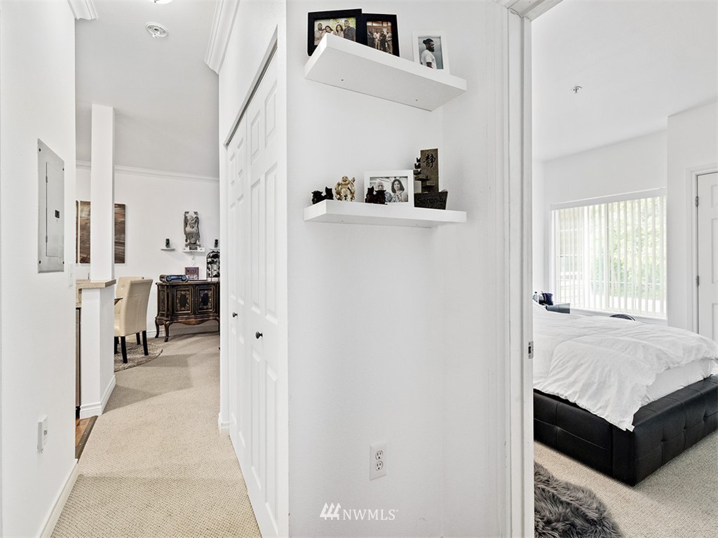 801 Rainier Avenue North, Unit G234 Renton, WA 98057 - Photo 11 of 19 a view of a bedroom from the hallway