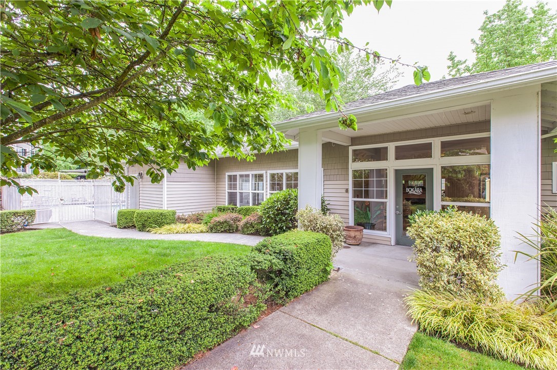 801 Rainier Avenue North, Unit G234 Renton, WA 98057 - Photo 16 of 19 front view of a house with a yard
