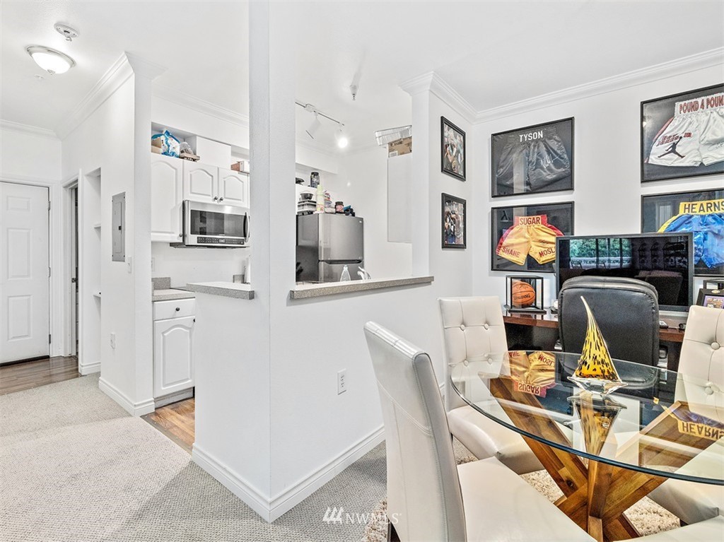 801 Rainier Avenue North, Unit G234 Renton, WA 98057 - Photo 4 of 19 a view of a workspace with furniture and wooden floor