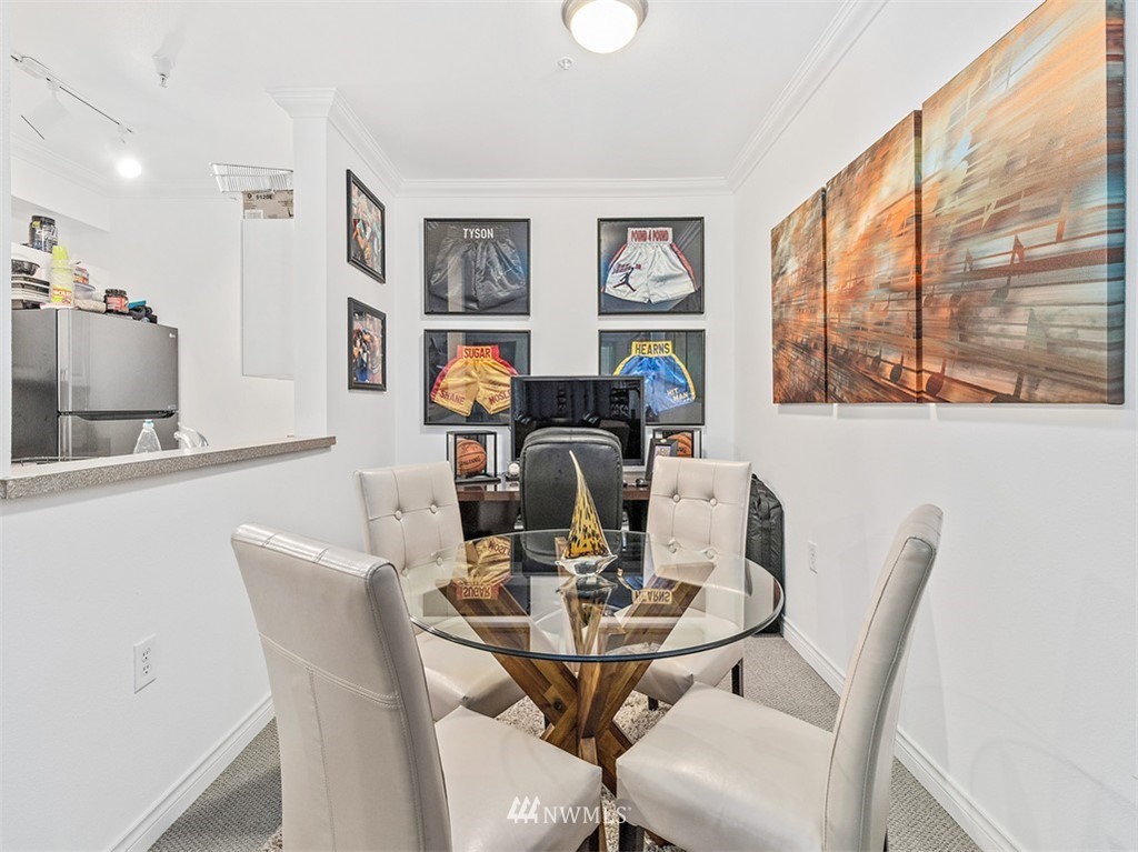 801 Rainier Avenue North, Unit G234 Renton, WA 98057 - Photo 5 of 19 a view of a dining room with furniture window and outside view