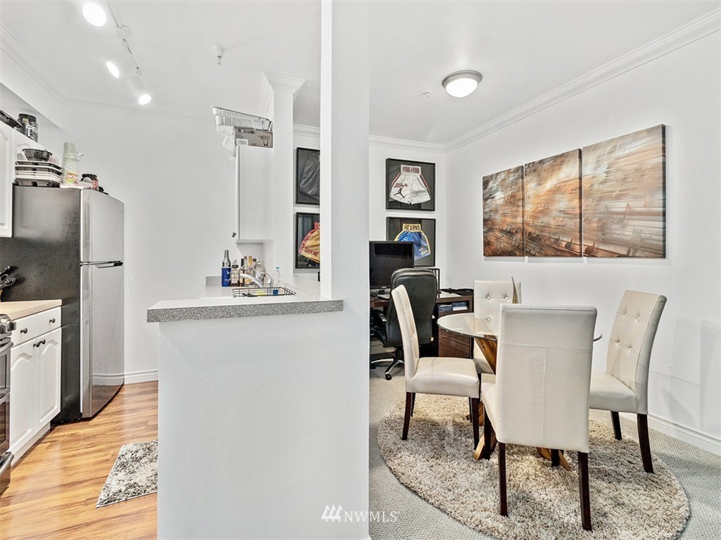801 Rainier Avenue North, Unit G234 Renton, WA 98057 - Photo 6 of 19 a view of a dining room with furniture