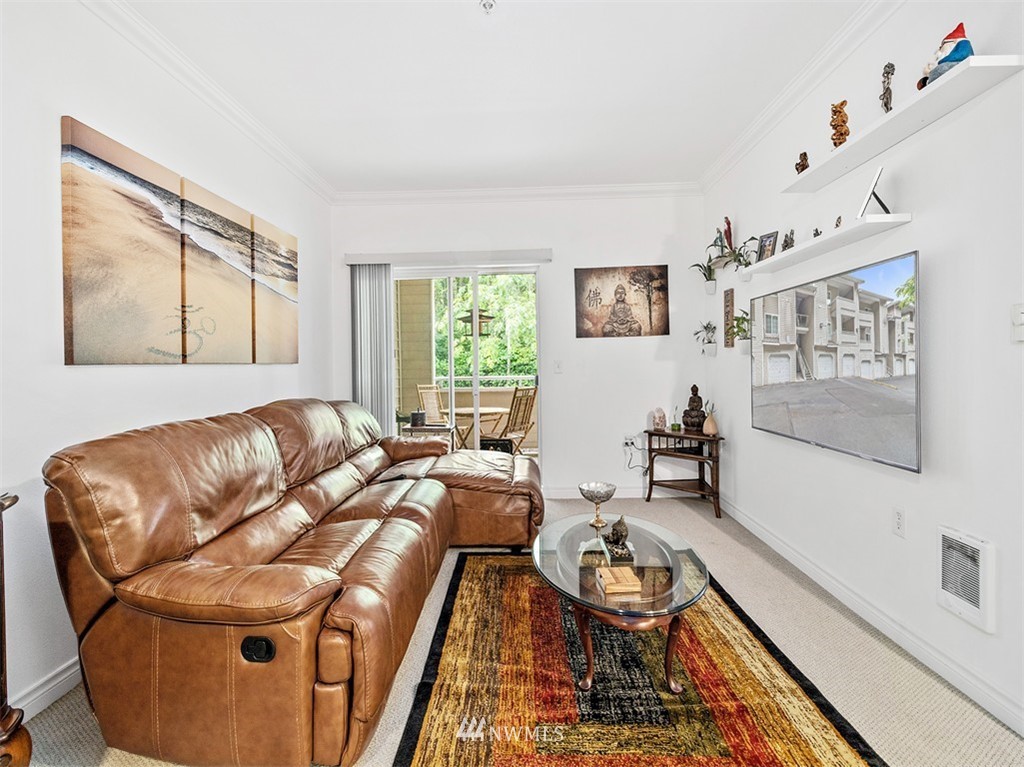 801 Rainier Avenue North, Unit G234 Renton, WA 98057 - Photo 9 of 19 a living room with furniture and a window
