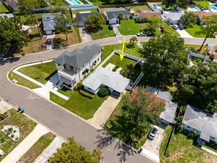 an aerial view of a house with a swimming pool