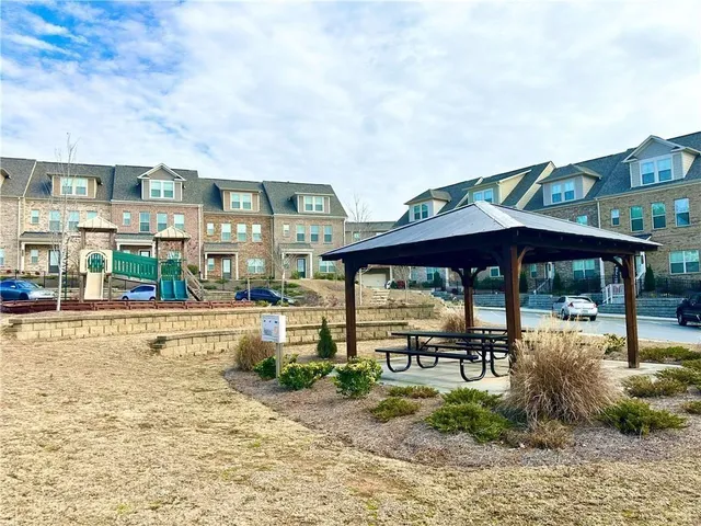 a view of a chairs and table in the patio