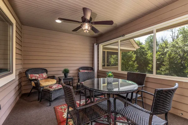 a outdoor dining space with furniture and a potted plant