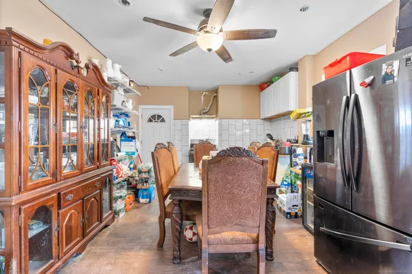 a dining room with furniture and window